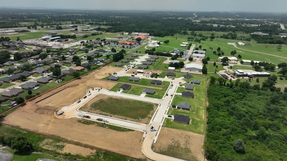 Cherokee Nation's Sallisaw Redbird Smith Estates opens with 12 families in new homes. The 16-acre development addresses the regional housing deficit through tribal funding.