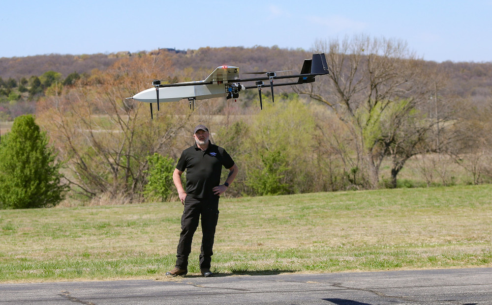 Andrew Clark with drone company uAvionix tests a drone at the Skyway 36 droneport in Tulsa. (Photo: Echo Reed, Osage News)