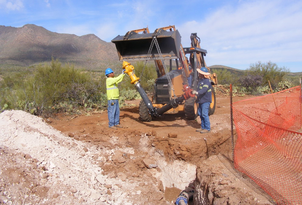 Indian Health Service construction workers install water pipeline infrastructure on tribal lands. The Tribal Access to Clean Water Act, introduced by Democratic lawmakers, would provide $3.15 billion over five years to expand such projects addressing the crisis where nearly half of tribal households lack clean water access. (Photo: Indian Health Service)