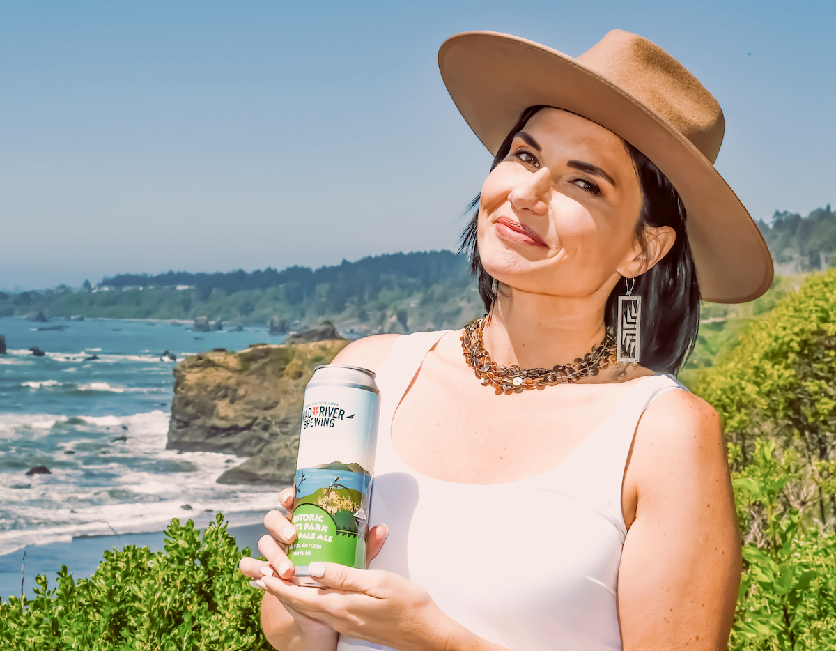 Linda Cooley, a member of the Yurok Tribe, serves as CEO of Blue Lake, Calif.-based Mad River Brewing Co., which the tribe acquired in October 2019. (Courtesy photo) Linda Cooley with a beer
